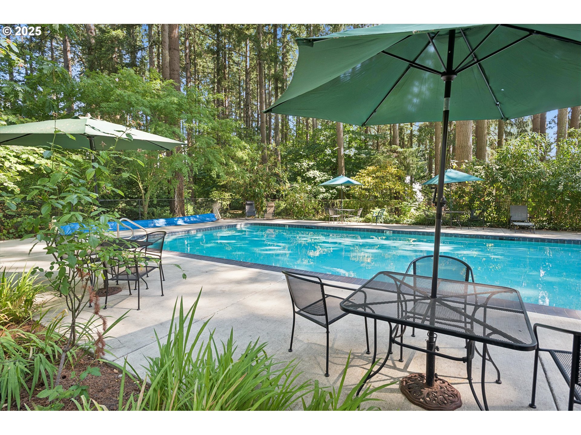 1200 Northeast Territorial Road, Unit 93 Canby, OR 97013 - Photo 35 of 36 a view of a table and chairs under an umbrella
