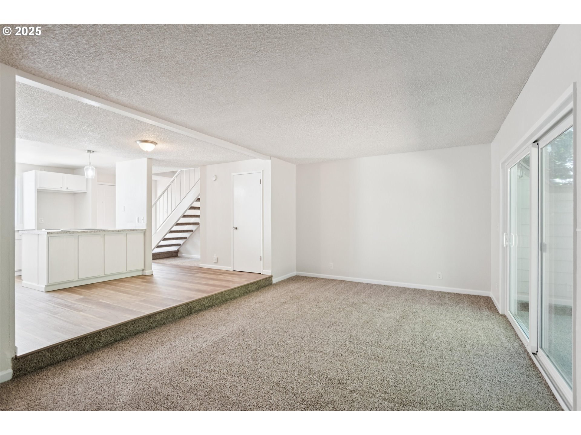 1200 Northeast Territorial Road, Unit 93 Canby, OR 97013 - Photo 9 of 36 a view of an empty room with wooden floor