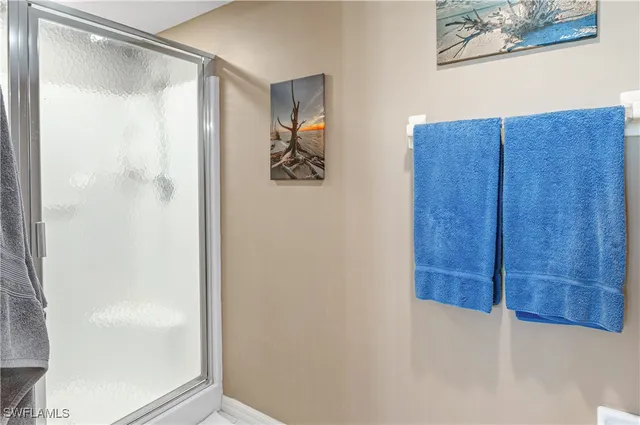 a bathroom with a shower and a sink