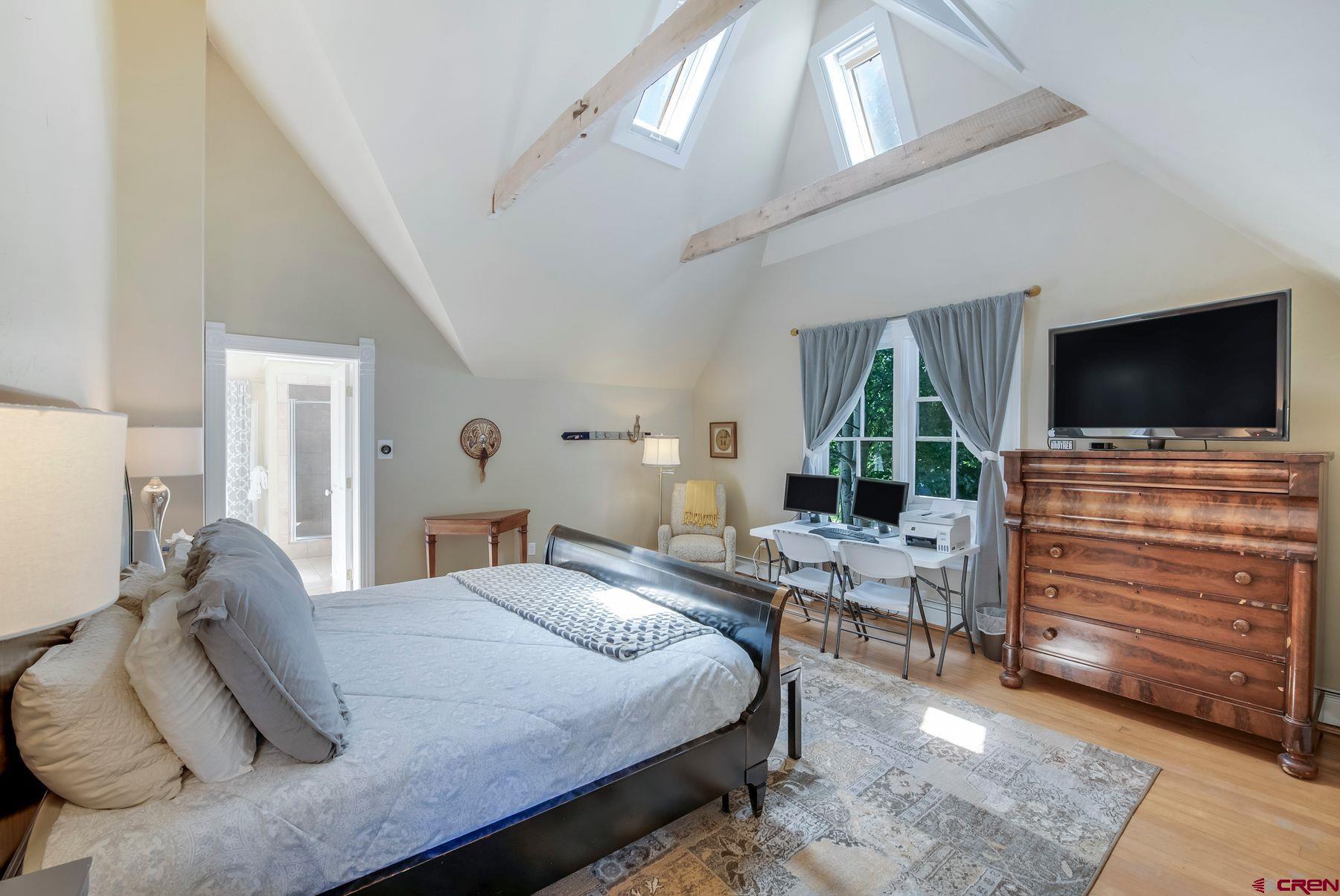 721 Maroon Avenue Crested Butte, CO 81224 - Photo 11 of 31 a bedroom with furniture and a flat screen tv