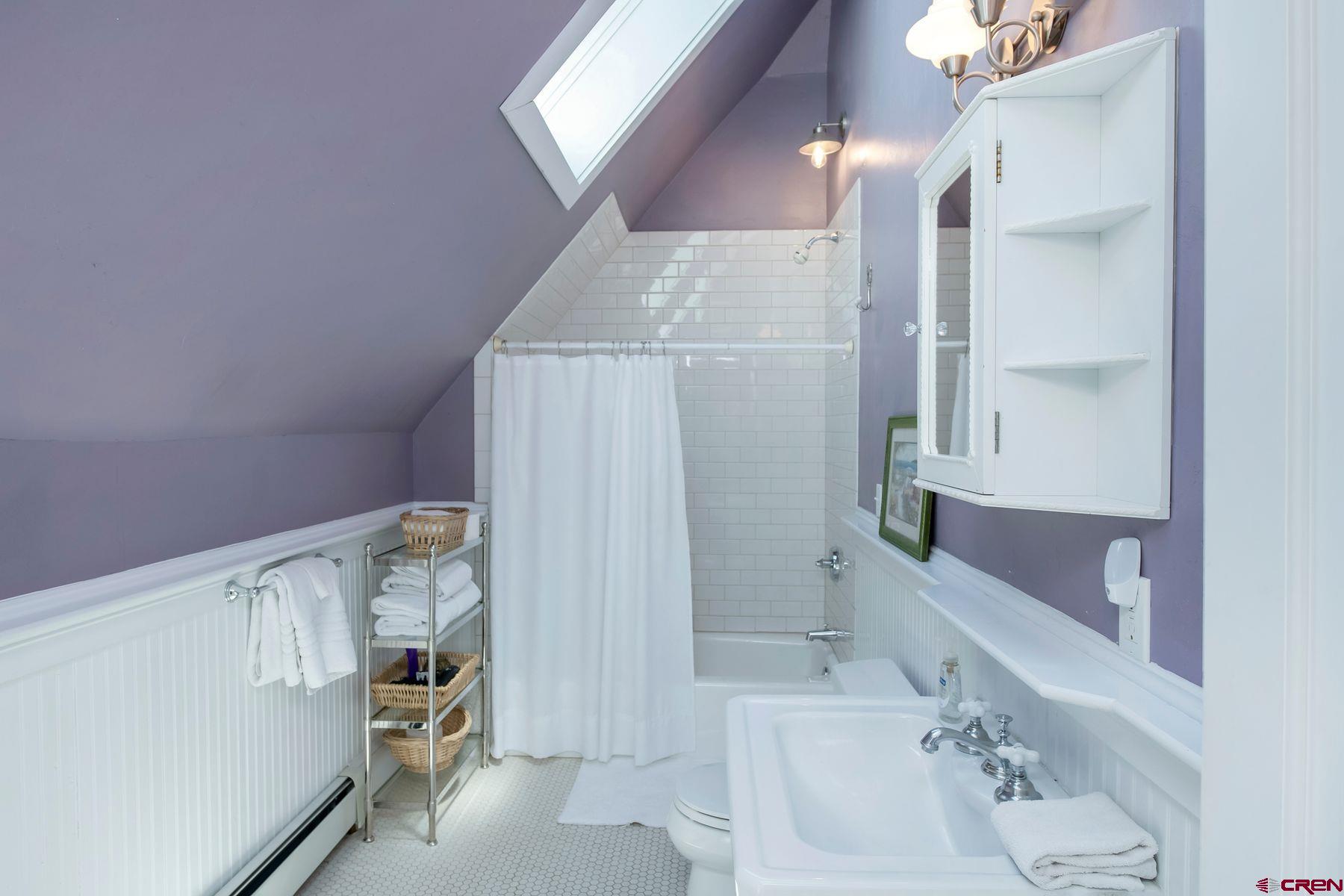 721 Maroon Avenue Crested Butte, CO 81224 - Photo 16 of 31 a bathroom with a bathtub and a sink