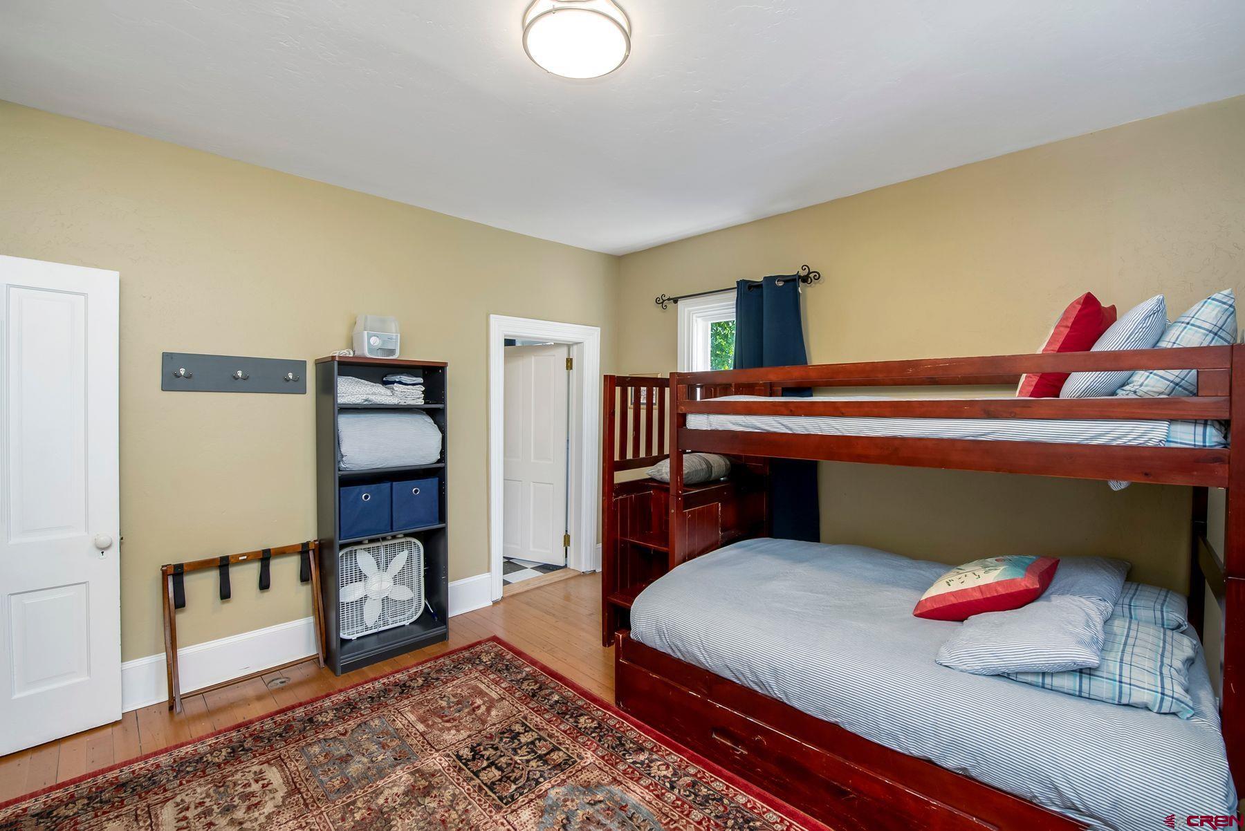 721 Maroon Avenue Crested Butte, CO 81224 - Photo 18 of 31 a bedroom with a bed and a dresser