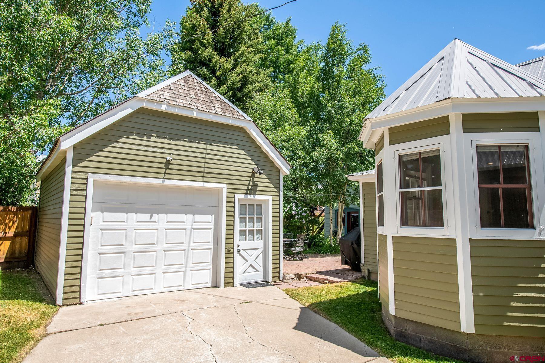 721 Maroon Avenue Crested Butte, CO 81224 - Photo 23 of 31 a front view of a house with a yard