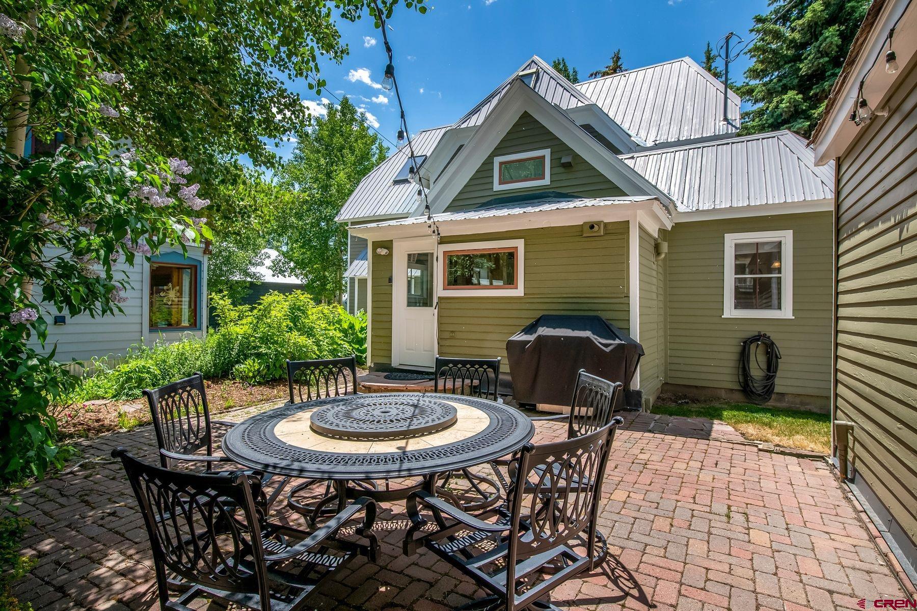 721 Maroon Avenue Crested Butte, CO 81224 - Photo 24 of 31 a front view of house with a garden and patio