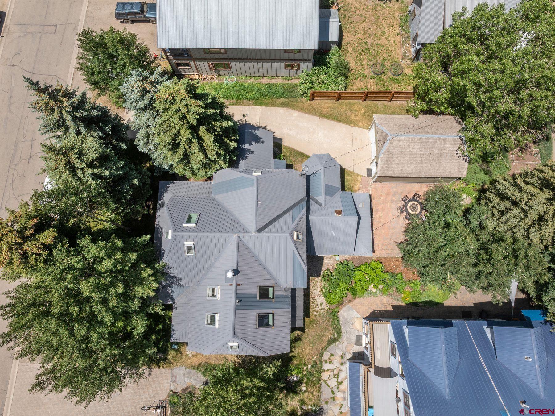 721 Maroon Avenue Crested Butte, CO 81224 - Photo 31 of 31 an aerial view of a house with plants and large trees