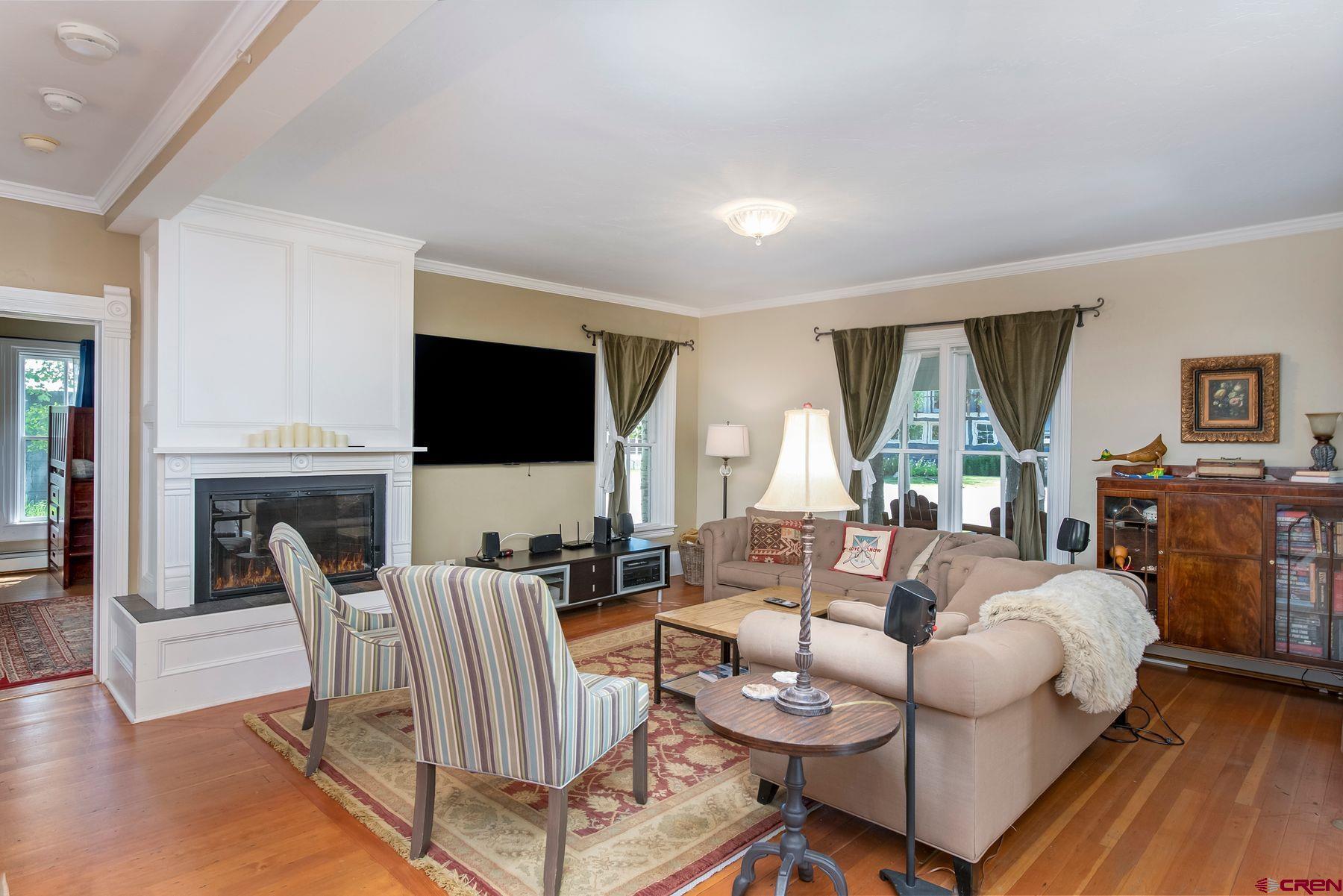 721 Maroon Avenue Crested Butte, CO 81224 - Photo 5 of 31 a living room with furniture fireplace and a flat screen tv
