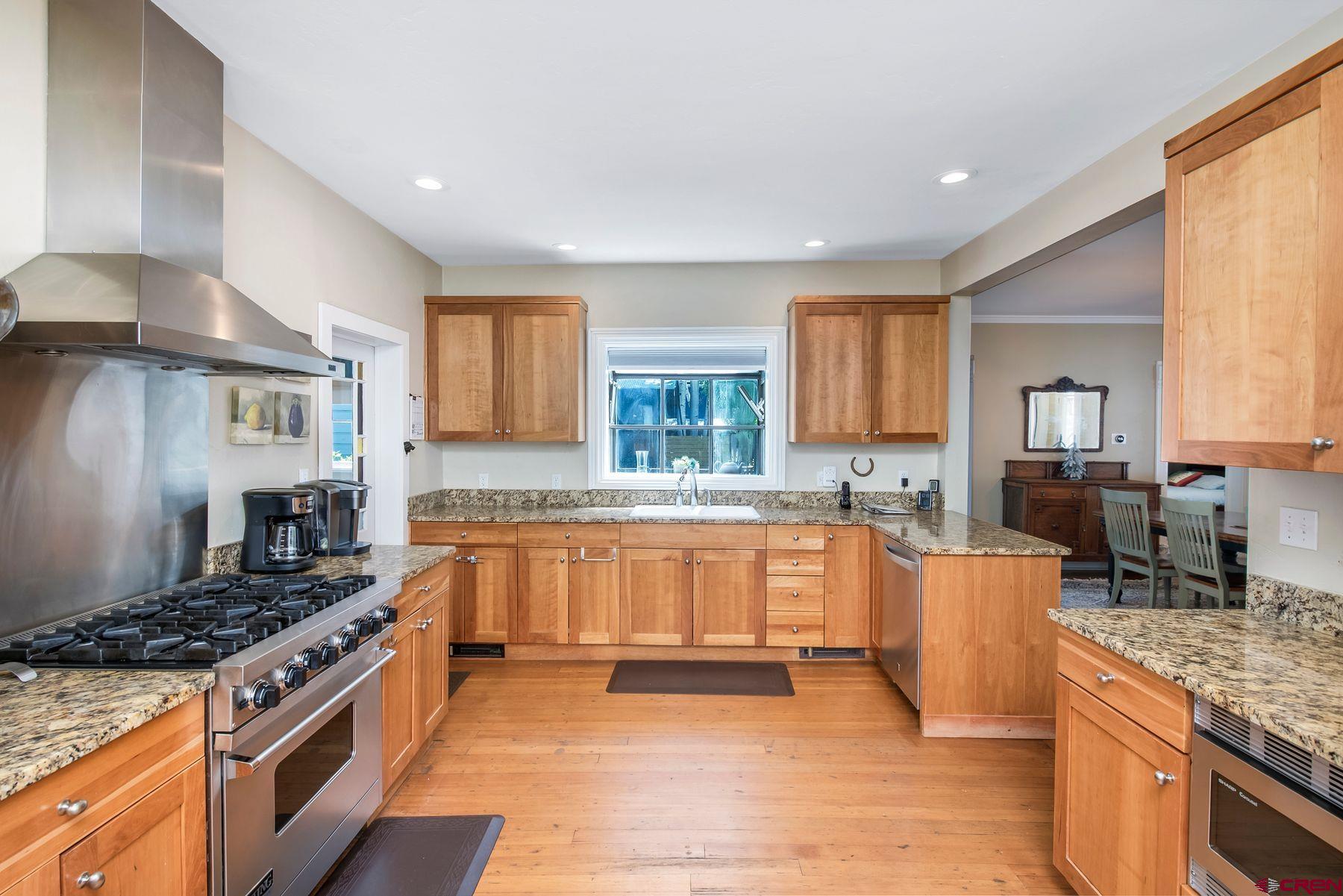 721 Maroon Avenue Crested Butte, CO 81224 - Photo 8 of 31 a large kitchen with stainless steel appliances granite countertop a stove and a sink