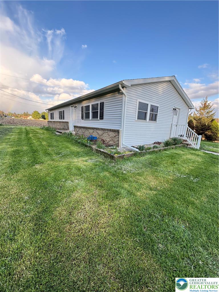 5460 Interchange Road Lehighton, PA 18235 - Photo 1 of 22 a house view with a garden space