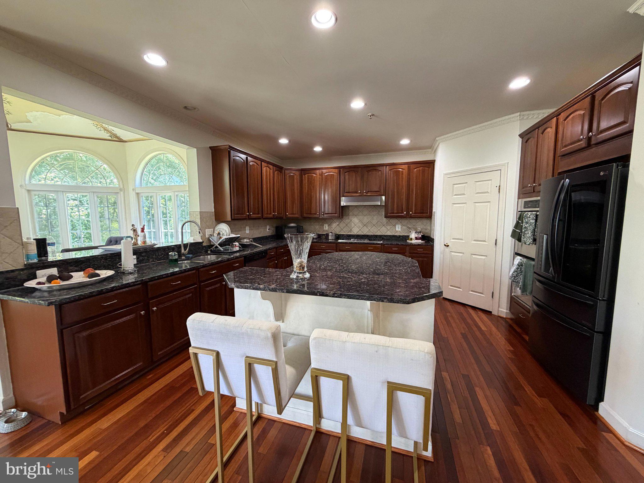 18724 Brooke Road Brinklow, MD 20862 - Photo 22 of 52 Elegant kitchen with rich wood tones.