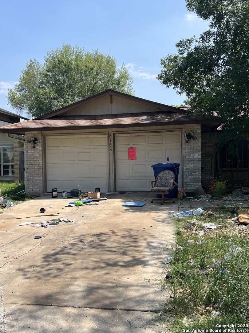 8158 Raritan Street San Antonio, TX 78254 - Photo 1 of 1 a backyard of a house with table and chairs
