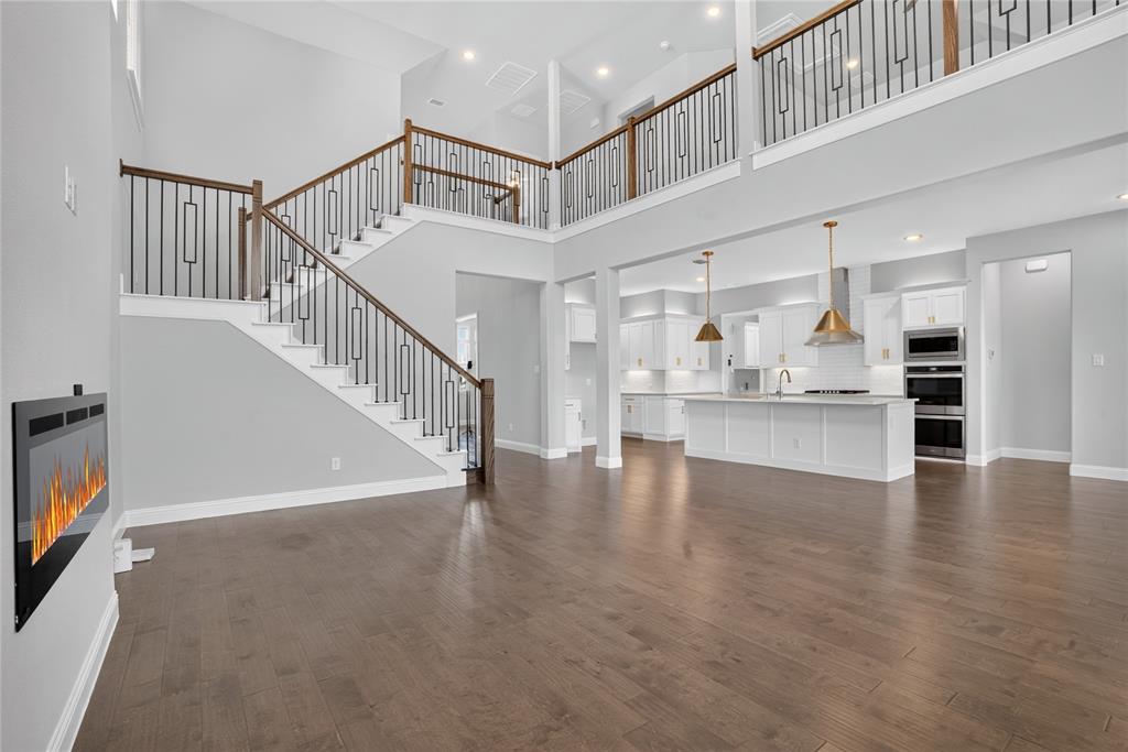 2528 Horsetail Road Frisco, TX 75033 - Photo 6 of 39 Upstairs game room and walkway is enhanced with premium designer railings that over look the soaring living area below creating an airy ambiance and dding a sophisticated architectural touch!