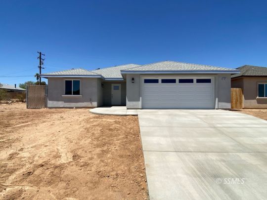 1521 Mayo Street Ridgecrest, CA 93555 - Photo 1 of 24 a front view of a house with yard