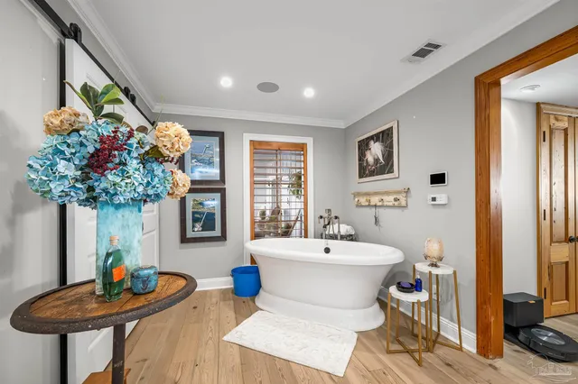 a bedroom with a bed and a lamp