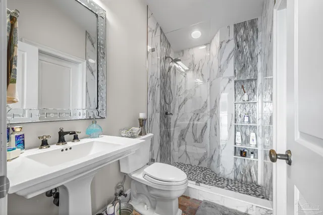 a living room with fireplace furniture and a flat screen tv