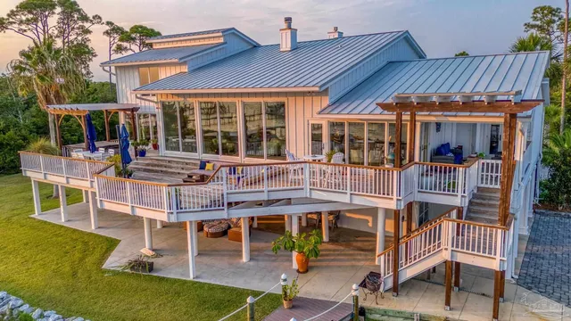 a swimming pool with outdoor seating and yard
