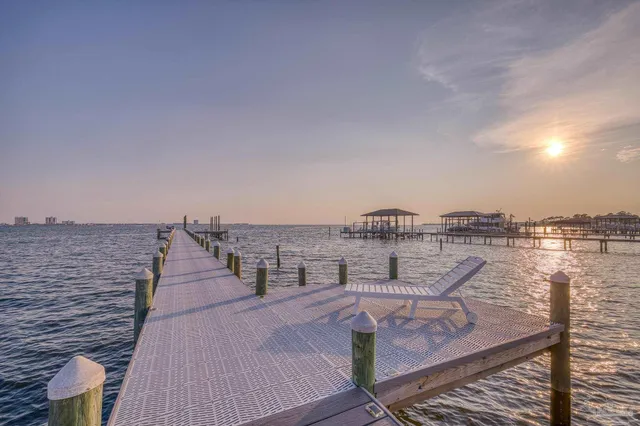 a view of a balcony with potted plants