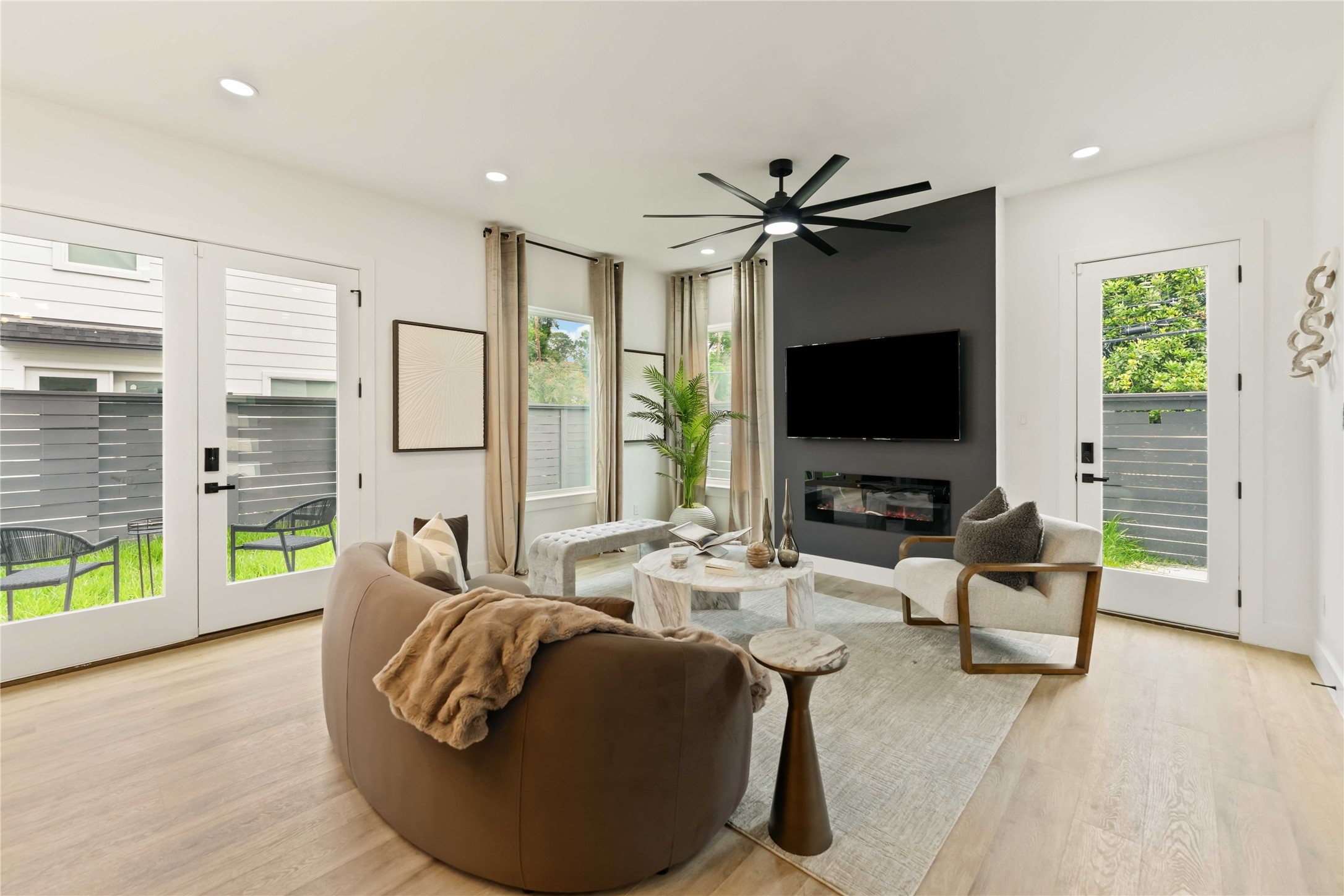6539 Sealey Street Houston, TX 77091 - Photo 7 of 28 a living room with furniture and a flat screen tv