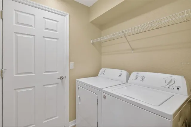 a utility room with dryer and washer