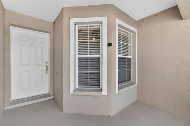 a view of empty room with windows