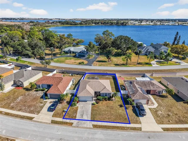 an aerial view of a house with outdoor space