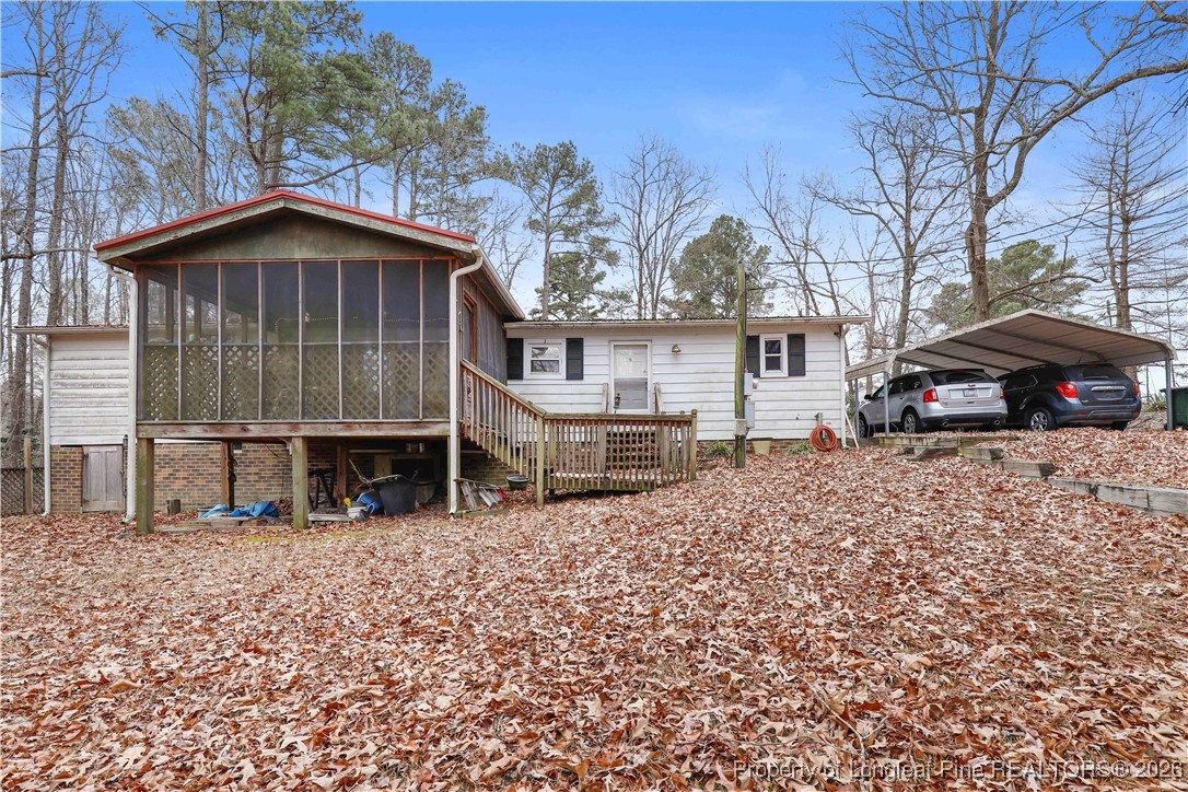 156 Connell Road Carthage, NC 28327 - Photo 29 of 43 a view of a house with a yard and garage