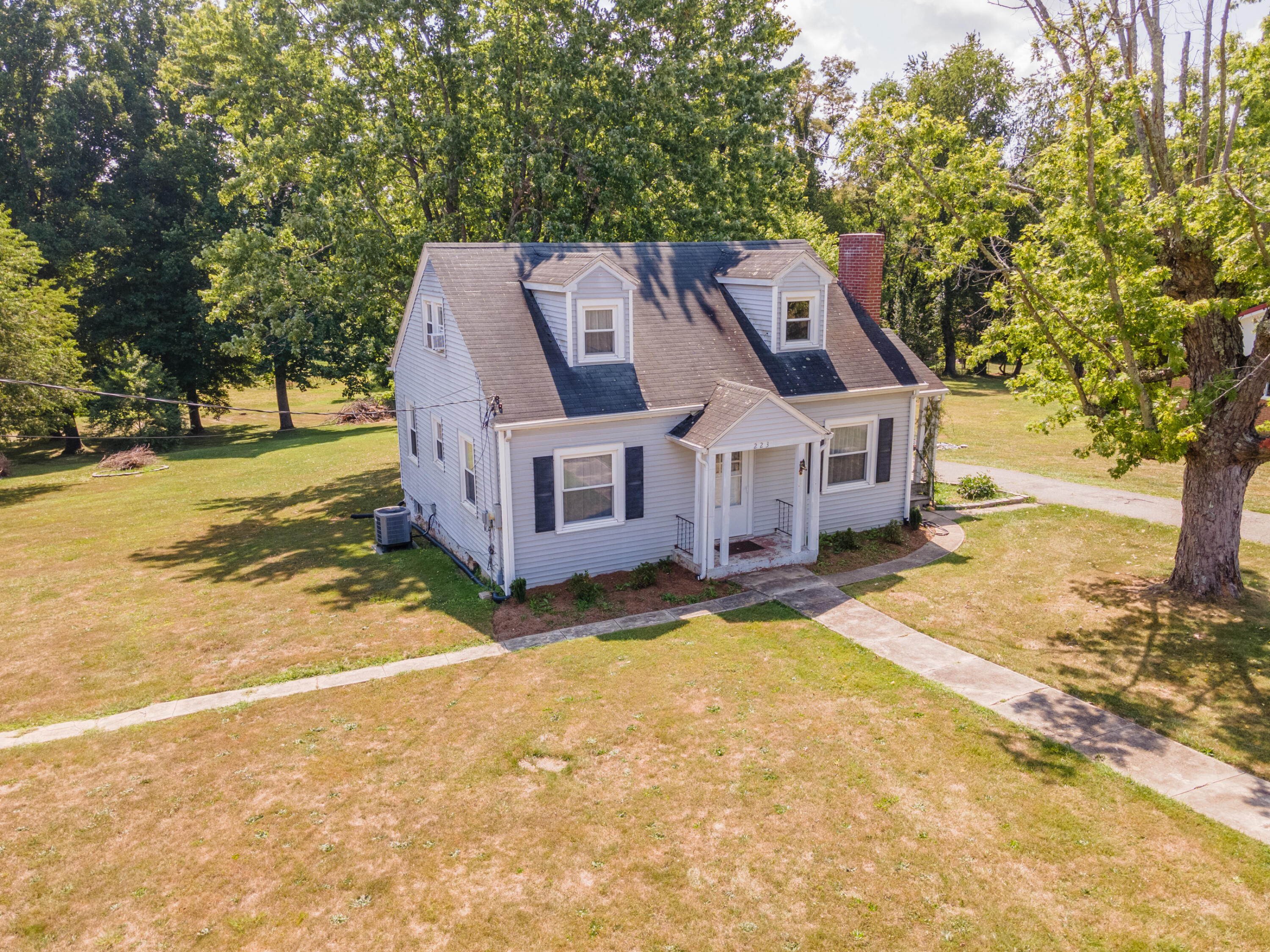 a aerial view of a house with a yard
