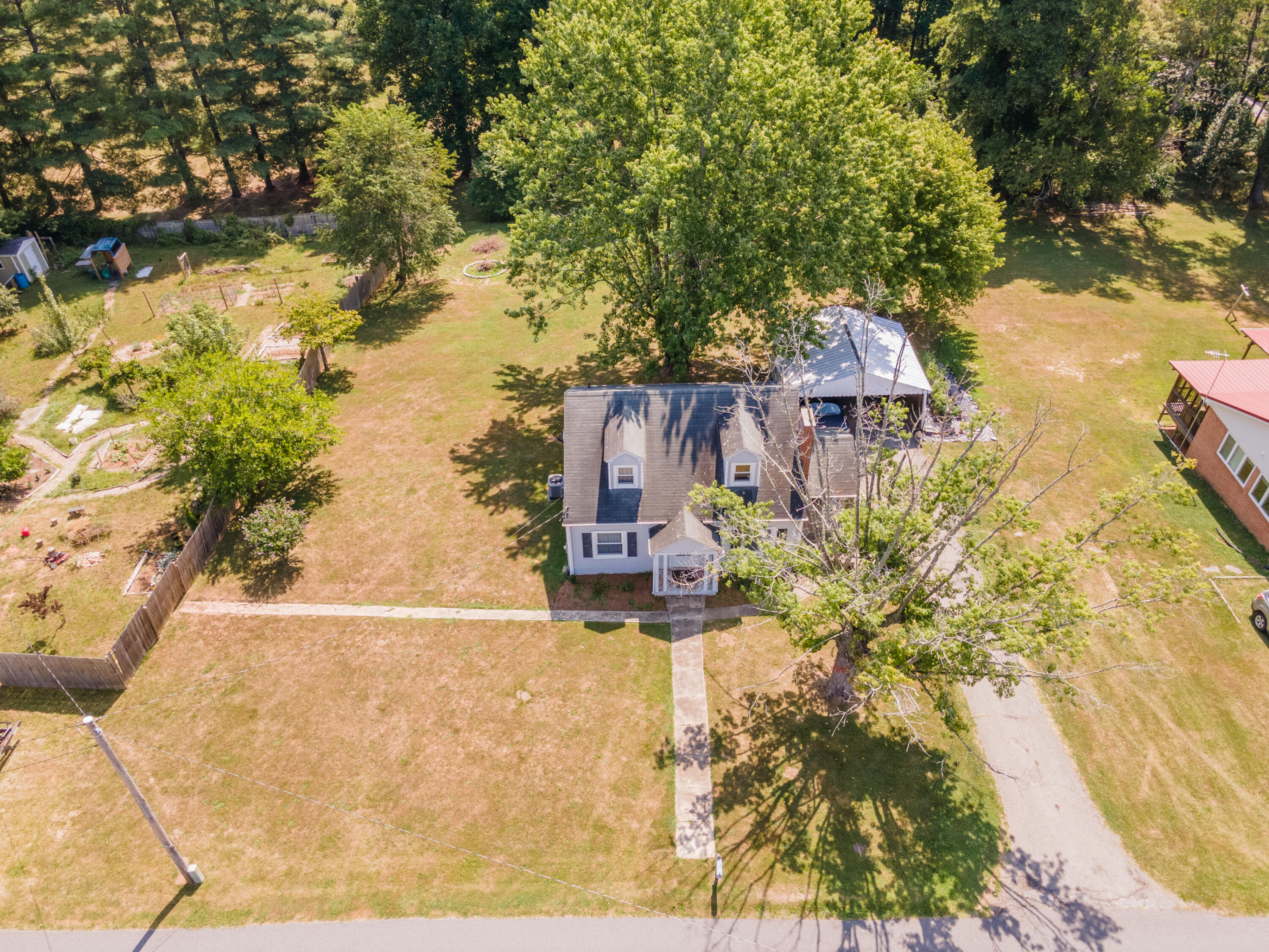 223 Newtown Road Northeast Floyd, VA 24091 - Photo 3 of 44 an aerial view of a house with a yard and large trees
