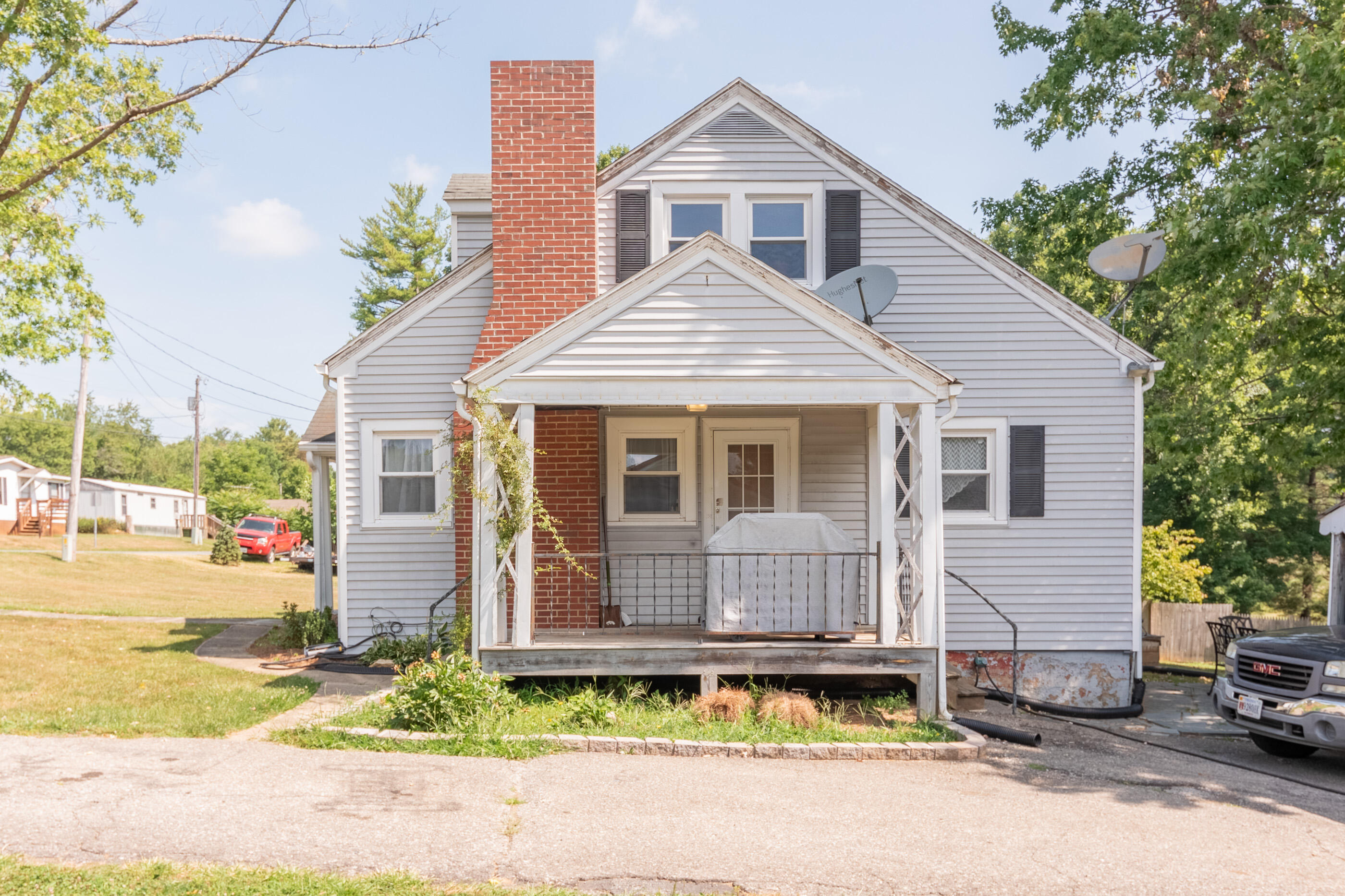 223 Newtown Road Northeast Floyd, VA 24091 - Photo 35 of 44 a front view of a house with a yard and garage
