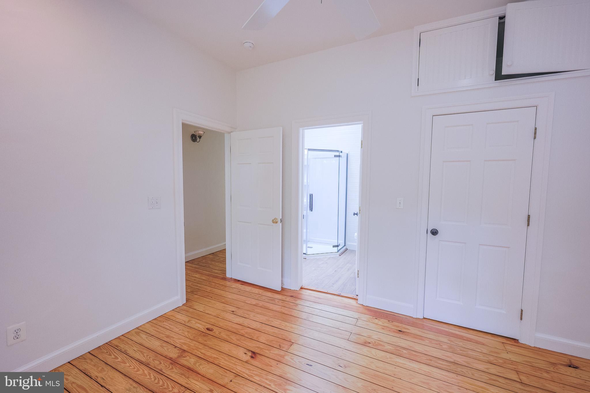 98 Swindler Hollow Road Sperryville, VA 22740 - Photo 8 of 25 a view of an empty room with wooden floor