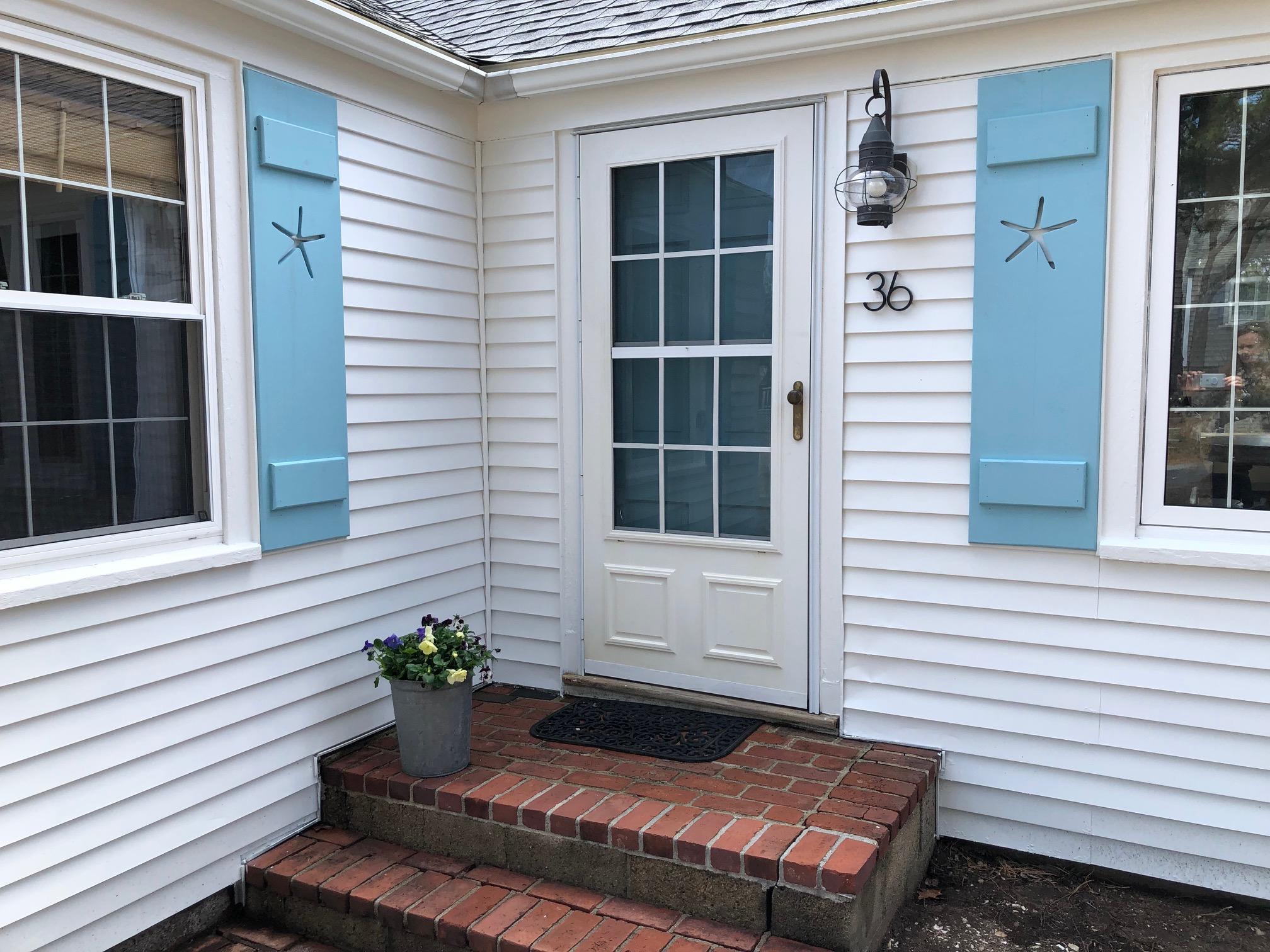36 Tobey Turtle Road South Chatham, MA 02659 - Photo 2 of 21 a front view of a house with a garden