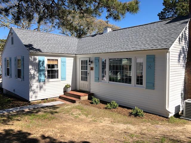 36 Tobey Turtle Road South Chatham, MA 02659 - Photo 21 of 21 a front view of a house with a yard