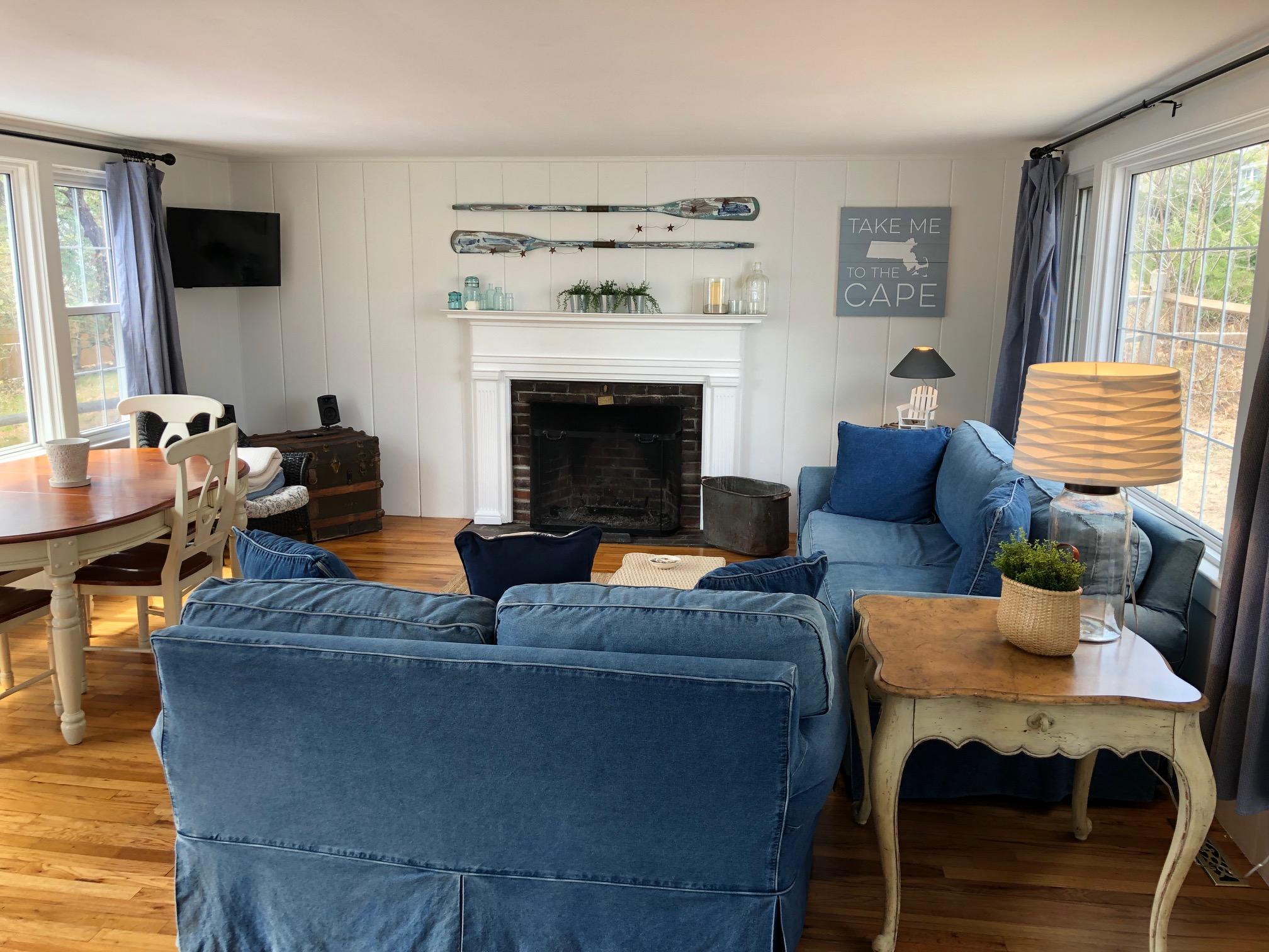 36 Tobey Turtle Road South Chatham, MA 02659 - Photo 3 of 21 a living room with furniture and a fireplace