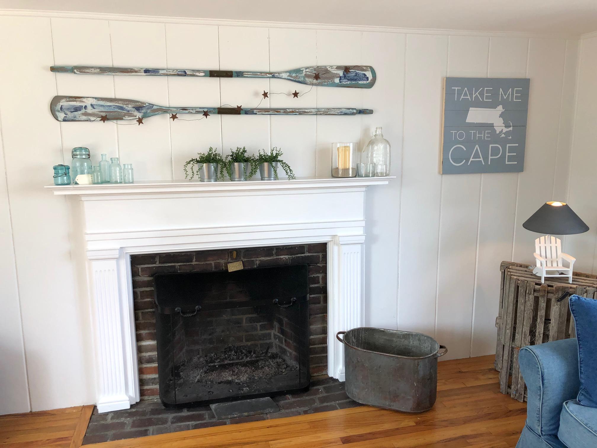 36 Tobey Turtle Road South Chatham, MA 02659 - Photo 6 of 21 a living room with furniture and a fireplace