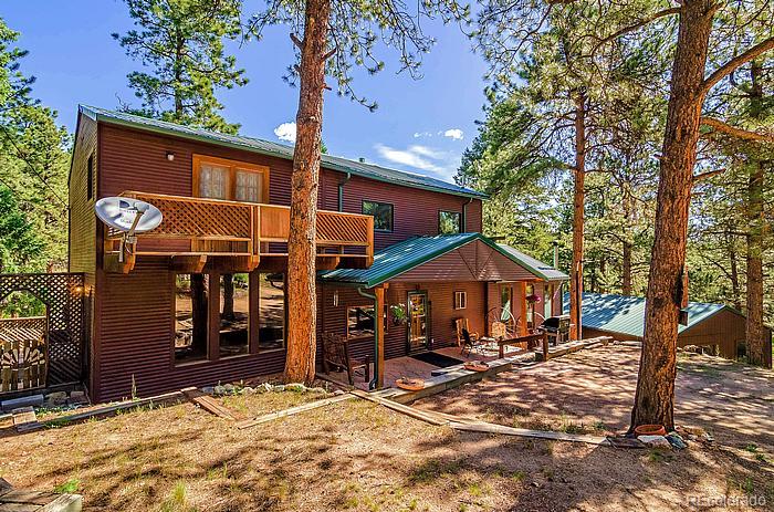 a under a tree in front of a house