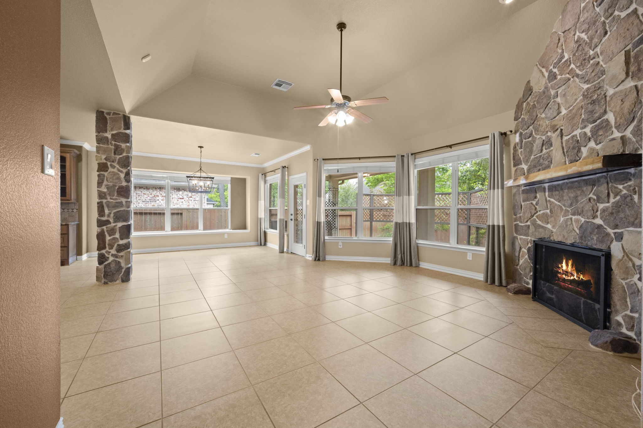 110 David Forest Lane Conroe, TX 77384 - Photo 23 of 35 a view of an empty room with a fireplace and a window