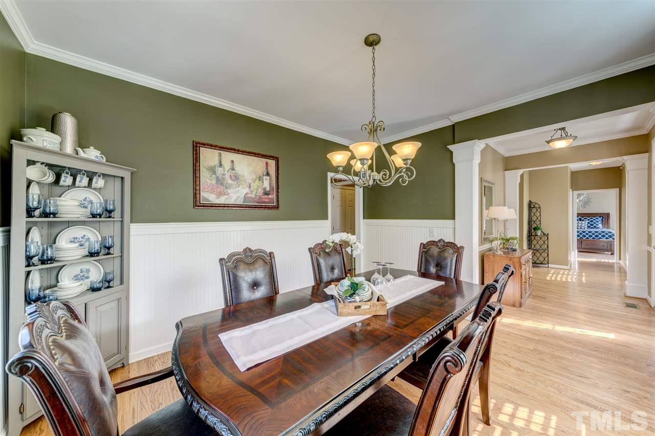3709 Farmstone Drive Raleigh, NC 27603 - Photo 7 of 30 Views of front yard, wainscoting and crown molding!