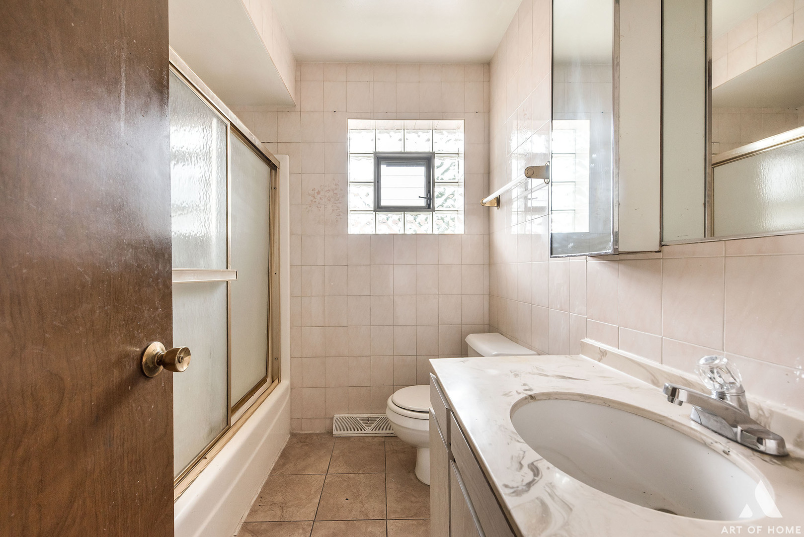 851 Addison Road Addison, IL 60101 - Photo 11 of 25 a bathroom with a granite countertop sink a toilet and a mirror
