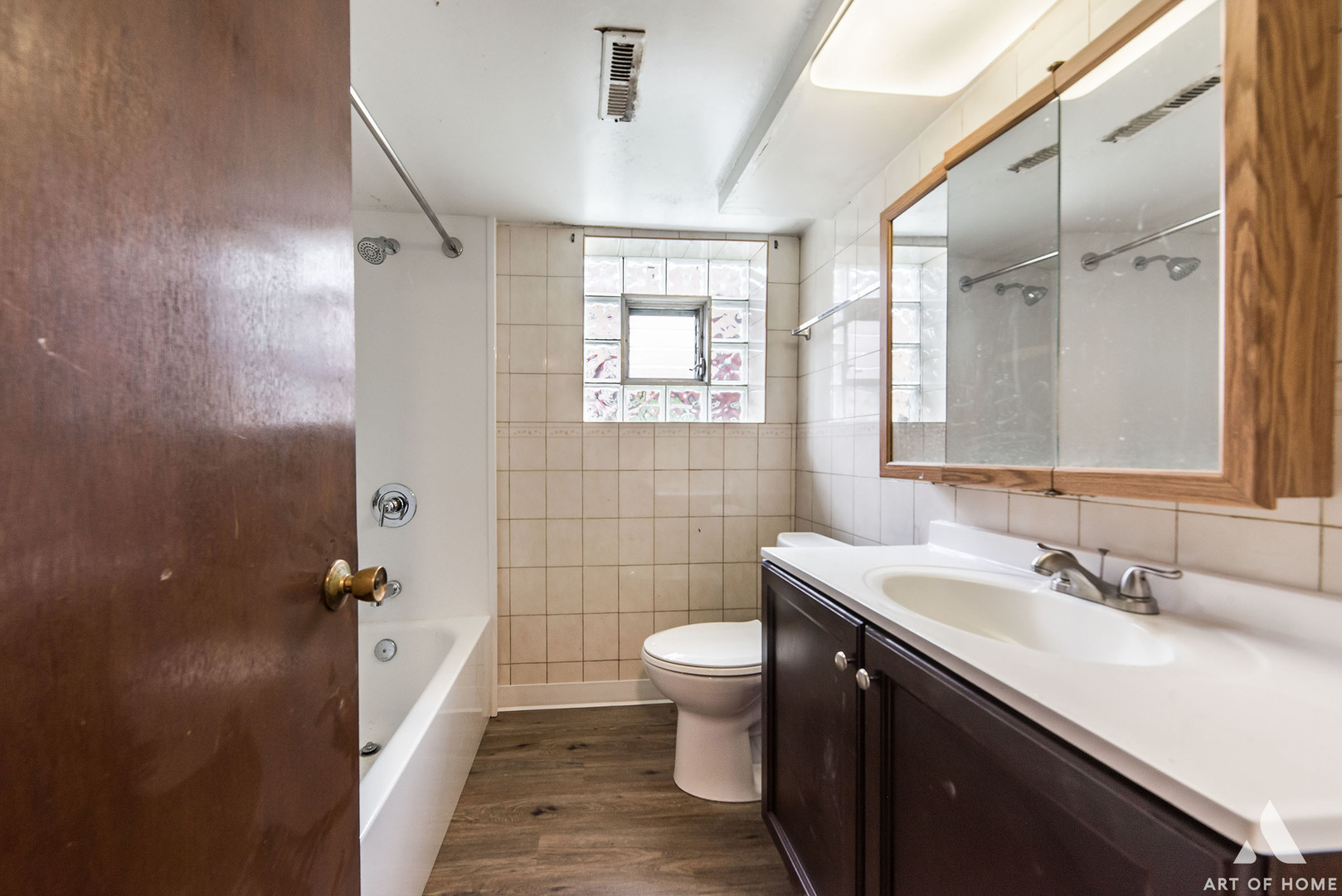 851 Addison Road Addison, IL 60101 - Photo 12 of 25 a bathroom with a sink a toilet a mirror and shower