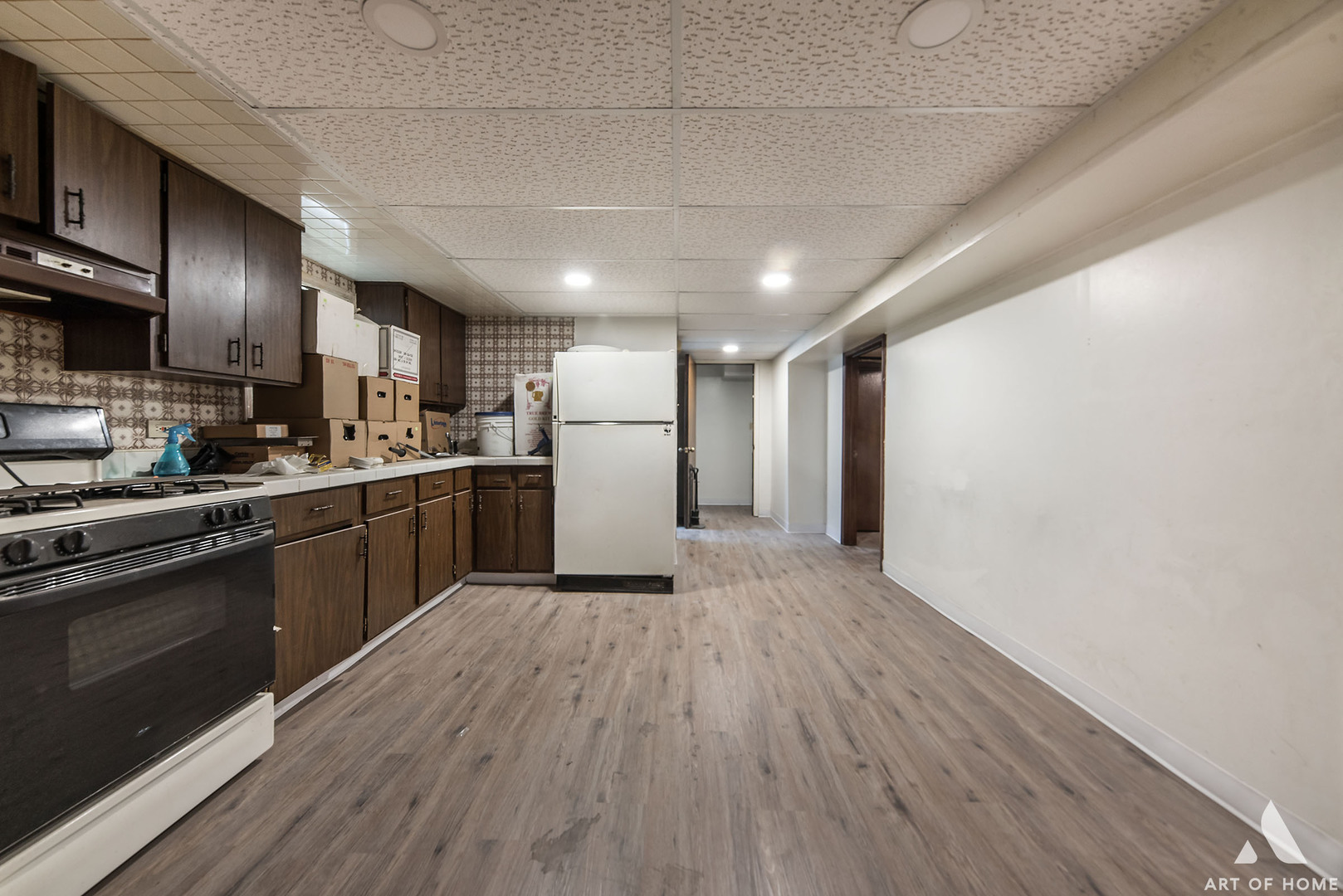 851 Addison Road Addison, IL 60101 - Photo 17 of 25 a kitchen with refrigerator and cabinets