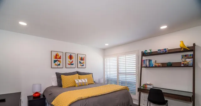 a bedroom with a bed and furniture