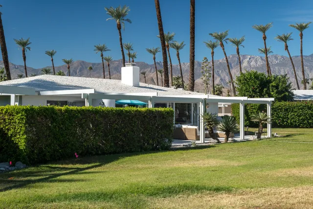 a front view of a house with swimming pool