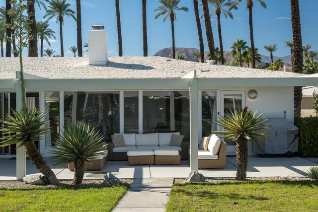 a view of a house with fountain bath and swimming pool