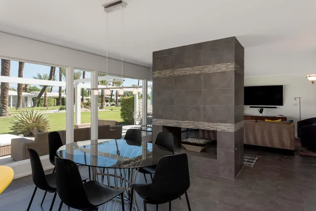 a kitchen with stainless steel appliances a refrigerator sink and microwave