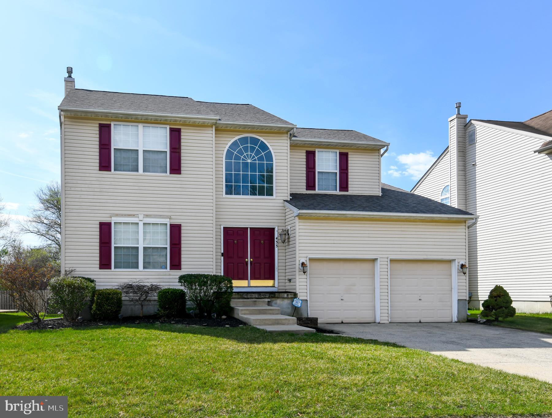 433 Eryn Road Wenonah, NJ 08090 - Photo 2 of 34 a front view of a house with a yard and garage