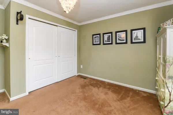 a view of a big room with painting on the wall