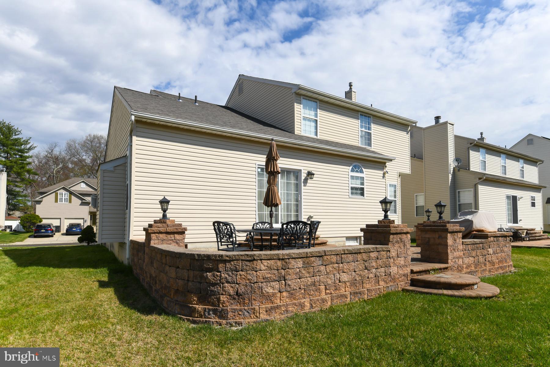 433 Eryn Road Wenonah, NJ 08090 - Photo 33 of 34 a front view of a house with a garden and plants