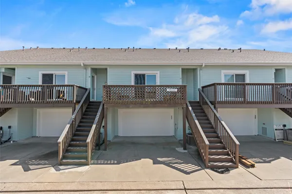 a front view of a house with stairs