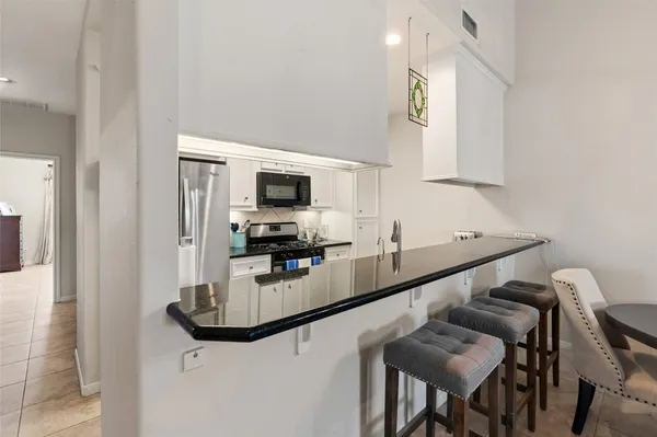 a kitchen with a stove and a microwave