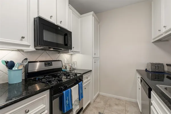 a bathroom with a sink toilet and mirror