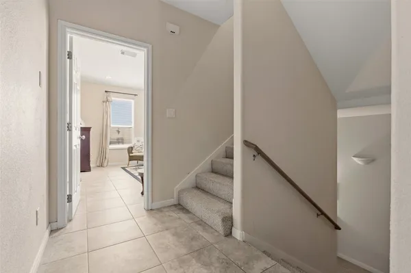 a bedroom with furniture and a chandelier